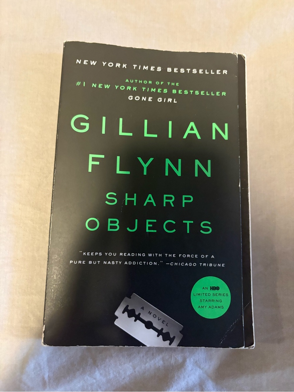 Gillian Flynn Novel Paperback in Black and Green
